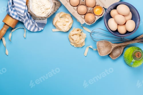 Preview: Cooking ingredients and utensils on blue background