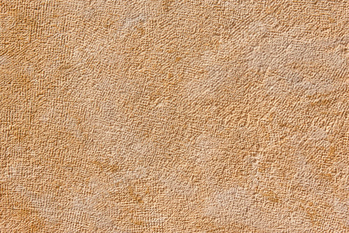 Preview: Textured warm stone wall background. Rough surface. Horizontal