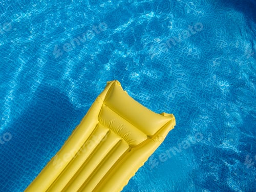 Preview: Top view of an inflatable mattress in a backyard swimming pool
