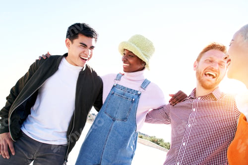 Preview: Smiling portrait of cheerful group multiracial friends looking at each other outdoors spring day.