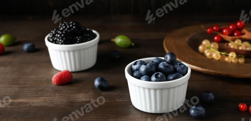 Preview: Concept of fresh food, berries on wooden table