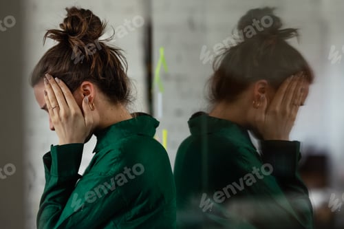 Preview: Young sad woman in office, having problem.