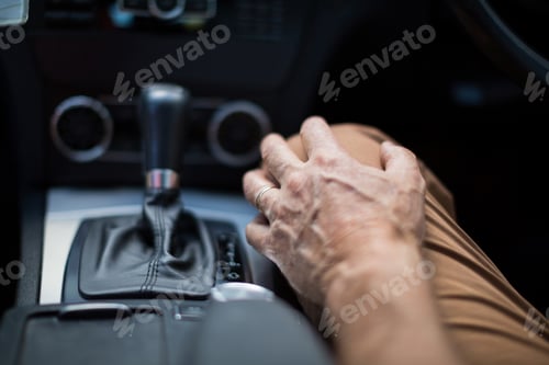 Preview: Close up of man sitting in car