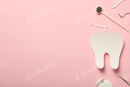 Preview: Teeth with dental tools for care, on a pink background.