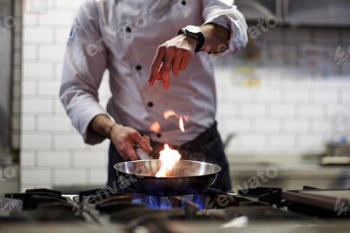 Preview: A man cooks cooking deep fryers in a kitchen fire.
