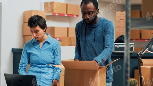 Preview: Team of employees doing highfive sign after preparing warehouse order