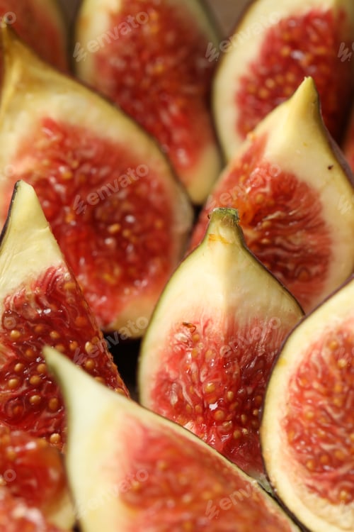 Preview: Slices of tasty fresh figs as background, closeup