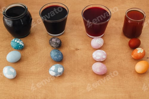 Preview: Colorful painted easter eggs on wooden table
