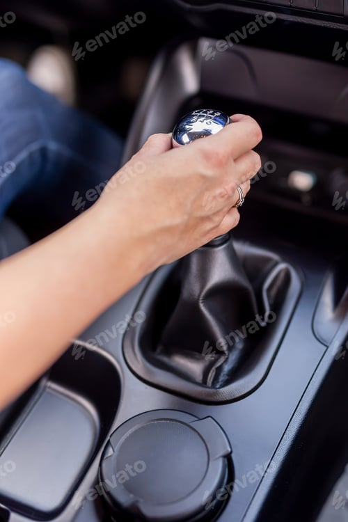 Preview: Woman driving a car shifting gears