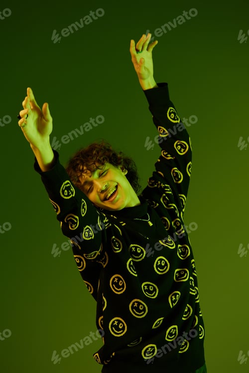 Preview: Man fashion and style accessories model with curly hair stylish sweater, hipster dance smile hands