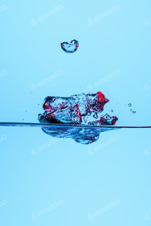 Preview: Water Bubble Suspended in Blue with Red Reflection