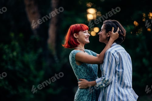 Preview: Lgbt couple lovely looking at each other, standing in front of each other, outdoor.