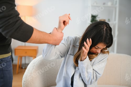 Preview: Man beating up his wife illustrating domestic violence