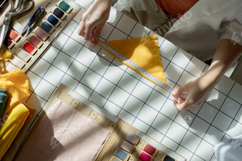 Preview: a designer is adjusting fabric to look stylish with her skill, a designer use her creativity to craf