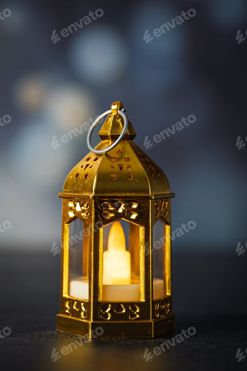 Preview: Golden decorative Moroccan lantern on dark background.