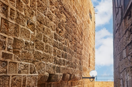 Preview: Stone narrow streets of the Old City of Jaffa against blue sky with clouds