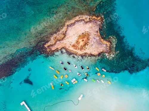 Preview: Island with boats parked near fig tree bay beach