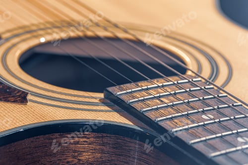 Preview: Close-up of a classical acoustic guitar in beautiful lighting.