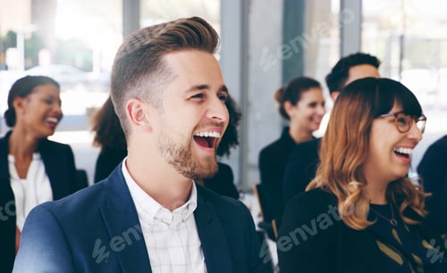 Preview: Shot of a group of businesspeople laughing while attending a conference