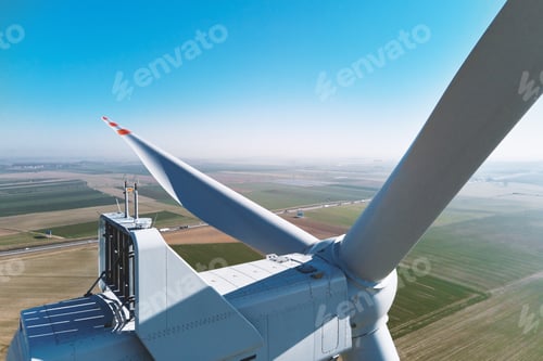Preview: Aerial view of part of windmill turbine in countryside, Green energy