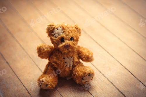Preview: cute fluffy teddy bear on the wonderful brown wooden background