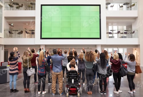 Preview: Students photograph screen with phones, back view full length