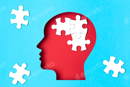 Preview: Papercut head with jigsaw puzzle pieces inside. Mental health problems, psychology, memory, logic