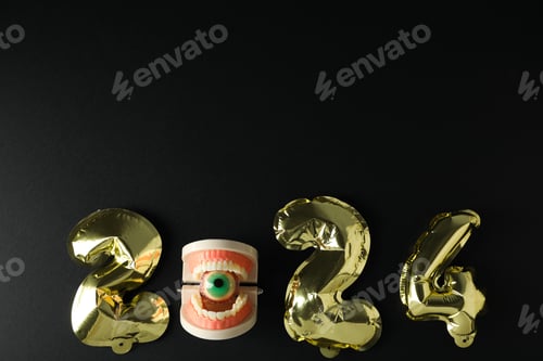 Preview: Teeth with Christmas accessories around, flat lay.