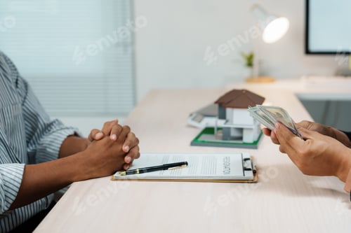 Preview: Real estate agent receiving cash payment for house purchase