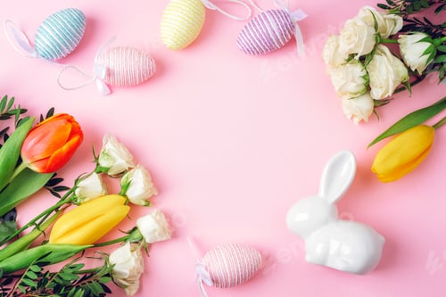 Preview: Easter decoration with colorful eggs, flowers and white bunny on pink background.