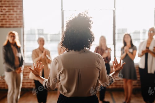 Preview: African american female empowering other colleagues in workplace