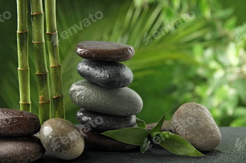Preview: Composition with stones on table against blurred background. Zen concept