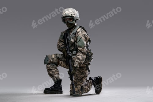 Preview: Modern servicewoman with rifle sitting against grey background
