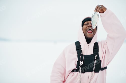 Preview: Stylish urban style african american man in pink hoodie