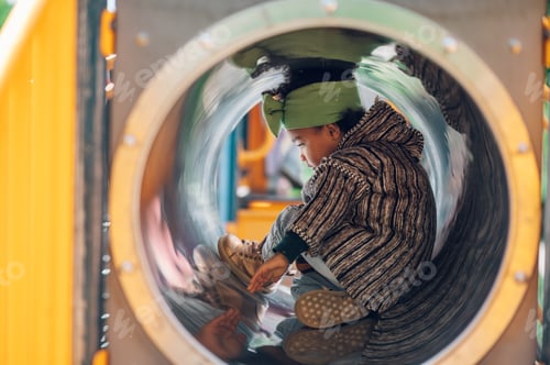 Preview: African american baby girl playing on an outdoor playground