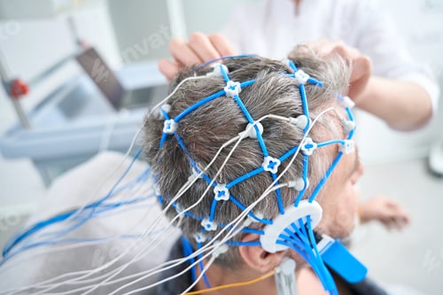 Preview: Middle-aged man undergoes a check-up in a modern clinic