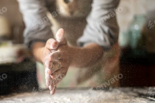 Preview: cook hands clap and cloud of spray flour in the kitchen d