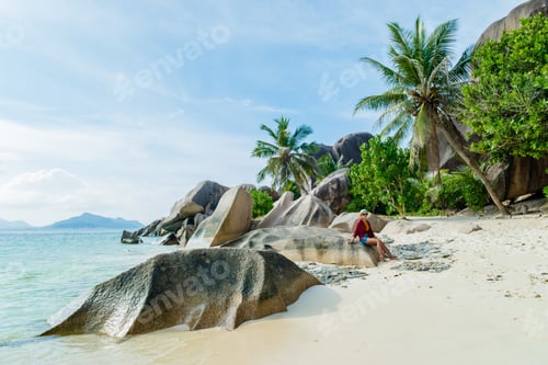 Preview: Young woman at Anse Source d'Argent beach La Digue Seychelles Islands