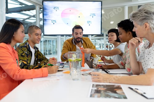 Preview: Front view of diverse business people discussing in the meeting at conference room in office