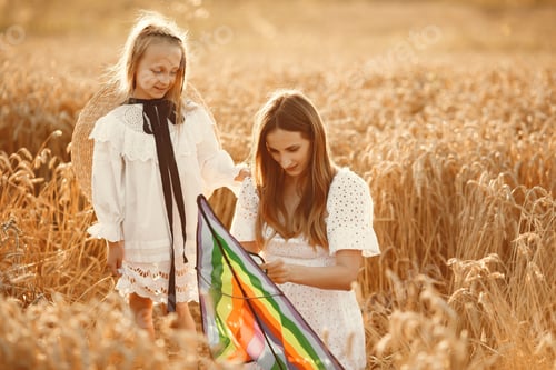 Preview: Mother with daughter in a wheat field