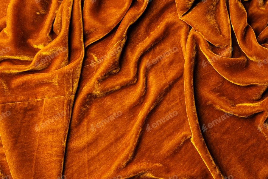Cover for top view of orange velvet textile as background