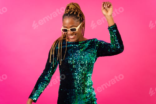 Preview: A black ethnic woman with braids party dancing on a pink background, having a lot of fun