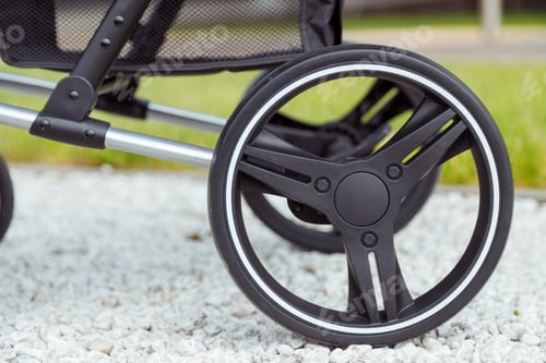 Preview: Baby stroller wheels close-up view, baby stroller details in summer