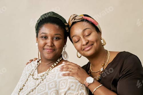 Preview: Two Smiling Black Women Wearing Headscarves Posing in Studio