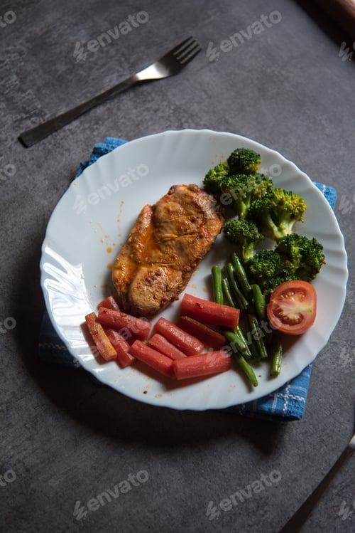 Preview: Grilled Chicken and Vegetables on White Plate