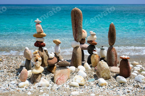 Preview: Concept of balance and harmony - pebble stone stacks on the beach
