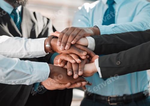 Preview: Shot of a group of unrecognizable businesspeople stacking their hands in the city