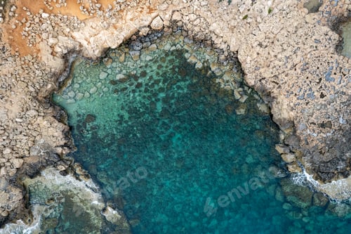 Preview: Drone aerial of rocky sea coastline transparent turquoise water. Seascape top view.