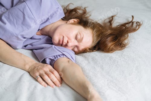 Preview: Woman Asleep in Bed