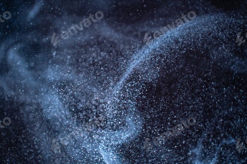 Preview: Dust particles cloud generating abstract shape on black background with copy space for text.